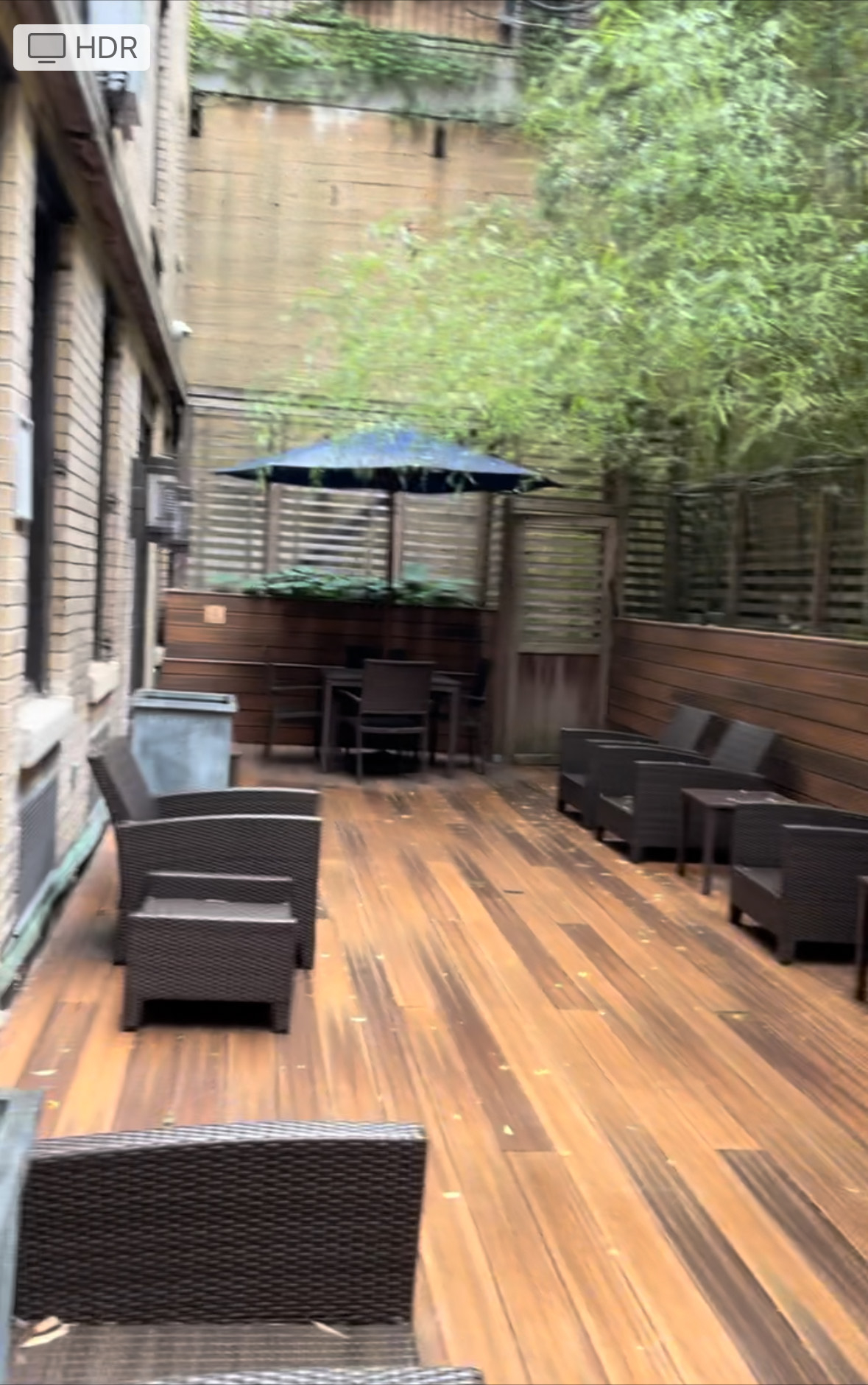 Office space featuring wood paneling and outdoor deck area
